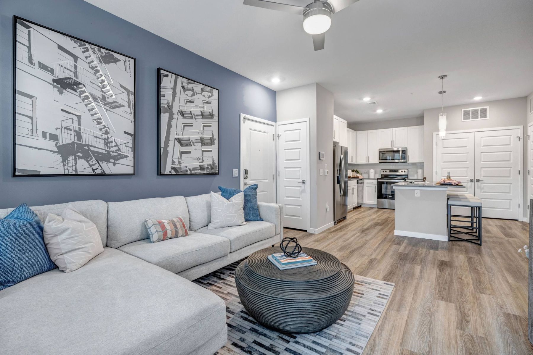 Luxury apartment kitchen with stainless steel appliances, granite countertops, and lots of storage space